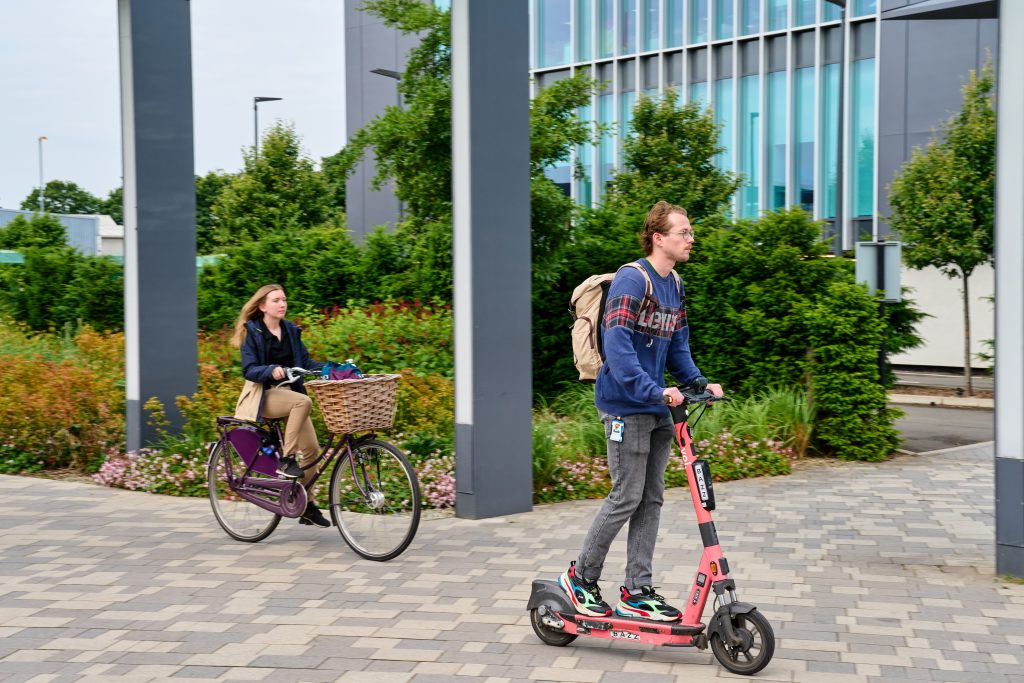 Woman on bike and man on e-scooter